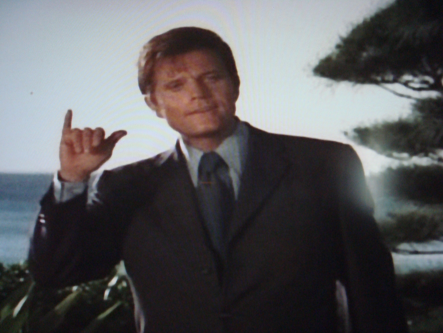 Jack Lord giving the satanic hand sign